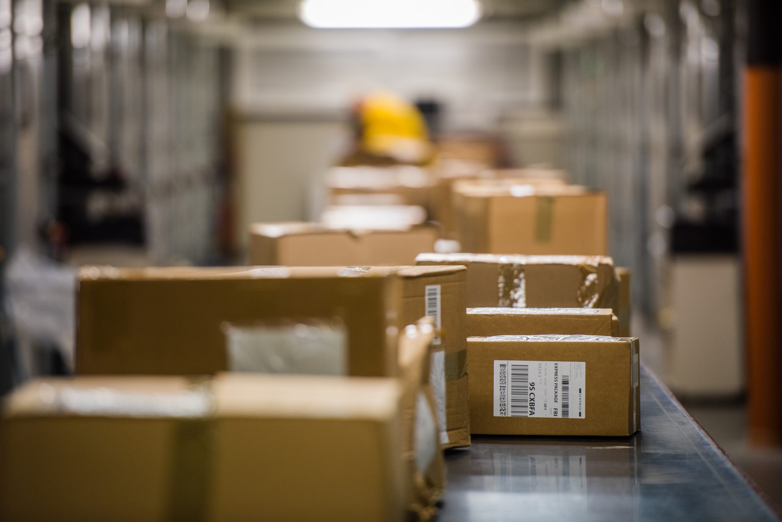 enterprise shipping | boxes on a conveyer belt image